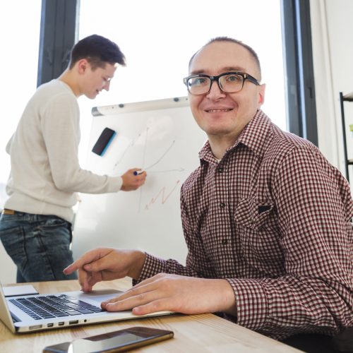 portrait-disabled-man-working-office
